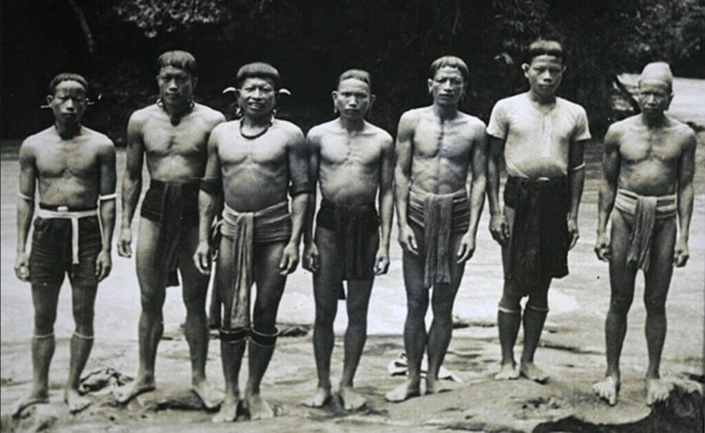 Indigenous men in a line